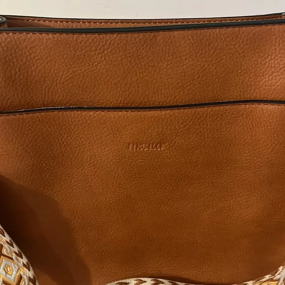 HKCLUF vegan leather crossbody with southwestern style woven strap